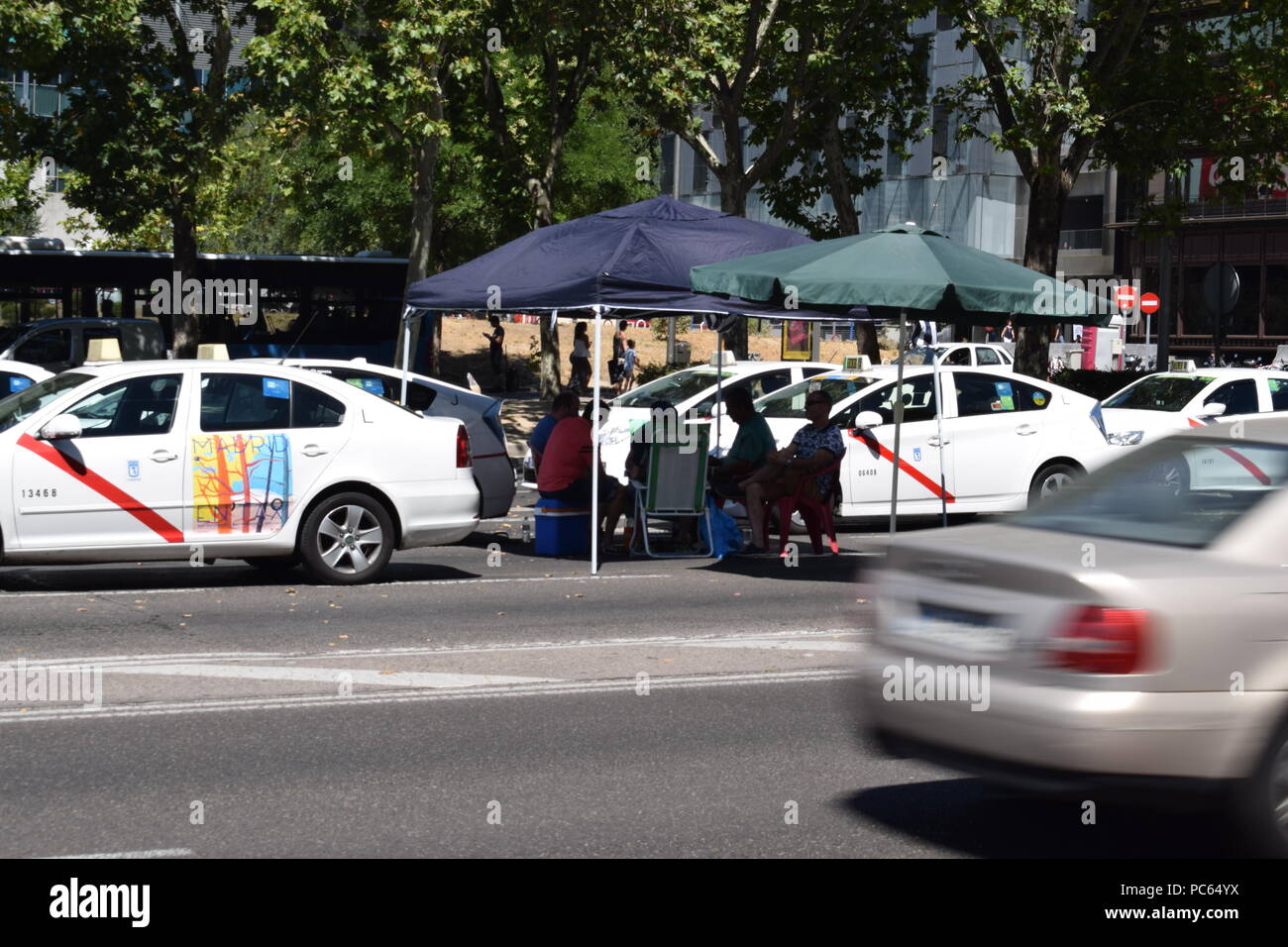 Madrid, Spain.  Taxis block an avenue amid a strike by cabbies in Madrid on July 31, 2018.    Taxi drivers across Spain kept striking against ride-hailing competitors such as Uber and Cabify, which they say unfairly threaten their livelihoods after government negotiations ended without a deal. The strike began in Barcelona last week and spread to Madrid at the weekend as drivers blocked main thoroughfares, demanding action from the government.  Sierra/797/Cordon Press Stock Photo