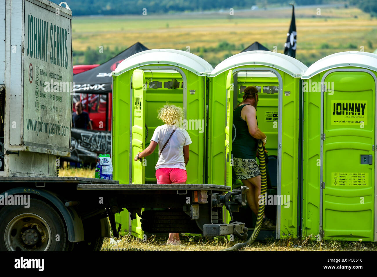 Usti Nad Labem, Czech Republic. 28th July, 2018. Mobile toilets at techno party in Vseborice, Usti Nad Labem, Czech Republic, on July 28, 2018. Credit: Vojtech Hajek/CTK Photo/Alamy Live News Stock Photo