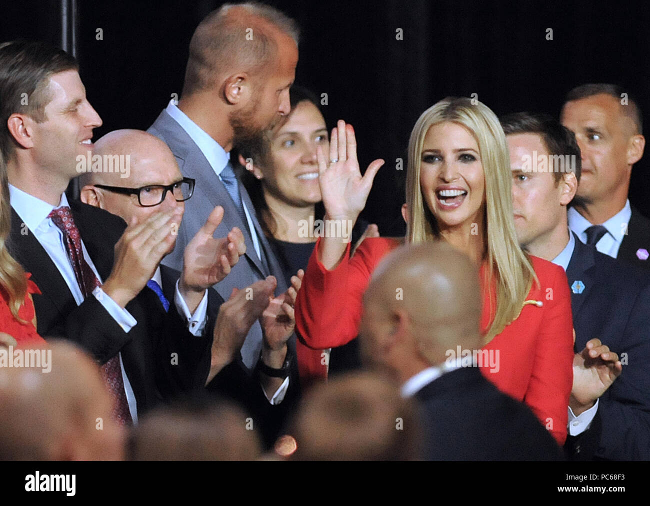 Tampa, Florida, USA. 31st July 2018. U.S. President Donald Trump's daughter, Ivanka Trump, waves as her father introduces her at a Make America Great Again Rally on July 31, 2018 at the Florida State Fairgrounds in Tampa, Florida. President Trump's son, Eric, is seen clapping at left.(Paul Hennessy/Alamy) Credit: Paul Hennessy/Alamy Live News Stock Photo