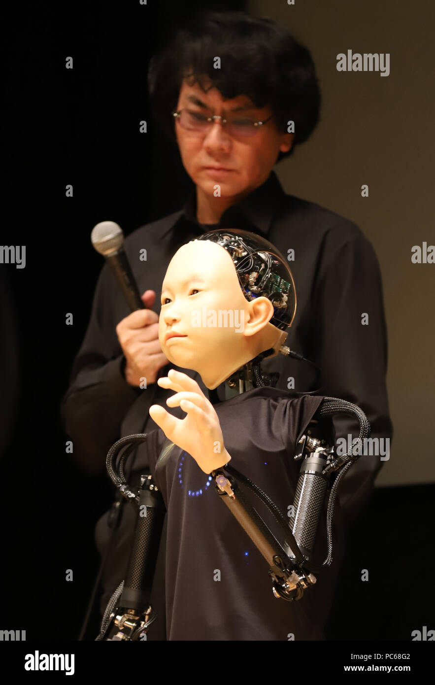 Tokyo, Japan. 31st July, 2018. A child humanoid robot "ibuki", developed by Osaka graduate school professor Hiroshi (back), is unveiled for the press at the National Museum of Emerging Science