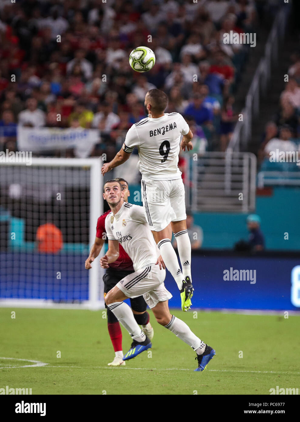 Miami Gardens, Florida, USA. 31st July, 2018. Real Madrid C.F. forward Karim Mostafa Benzema (9) leaps to head the ball during an International Champions Cup match between Real Madrid C.F. and Manchester United F.C. at the Hard Rock Stadium in Miami Gardens, Florida. Manchester United F.C. won the game 2-1. Credit: Mario Houben/ZUMA Wire/Alamy Live News Stock Photo