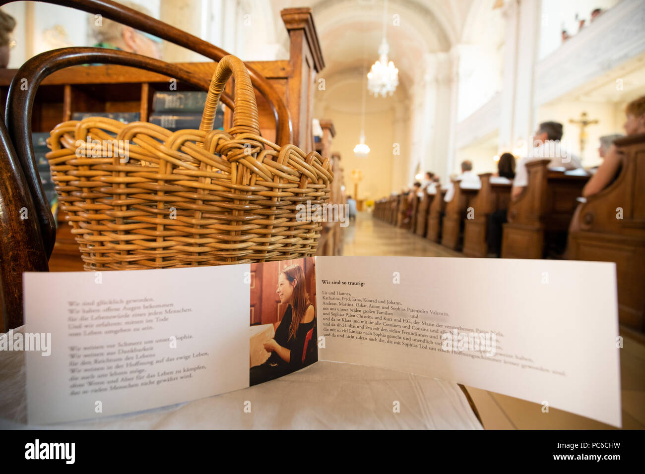 01 August 2018, Amberg, Germany: A card in memory of the killed student Sophia L. is lying in the Protestant Lutheran Paulaner church prior to the memorial service. Born in Amberg in the Upper Palatinate, the 28-year-old wanted to hitchhike from Leipzig to Bavaria in mid-June. According to the investigation, she was taken along by a 41-year-old truck driver and killed on her way to Upper Franconia. Sophia's body was found days later in Spain. The 41-year-old suspect is in extradition custody. Photo: Daniel Karmann/dpa Stock Photo
