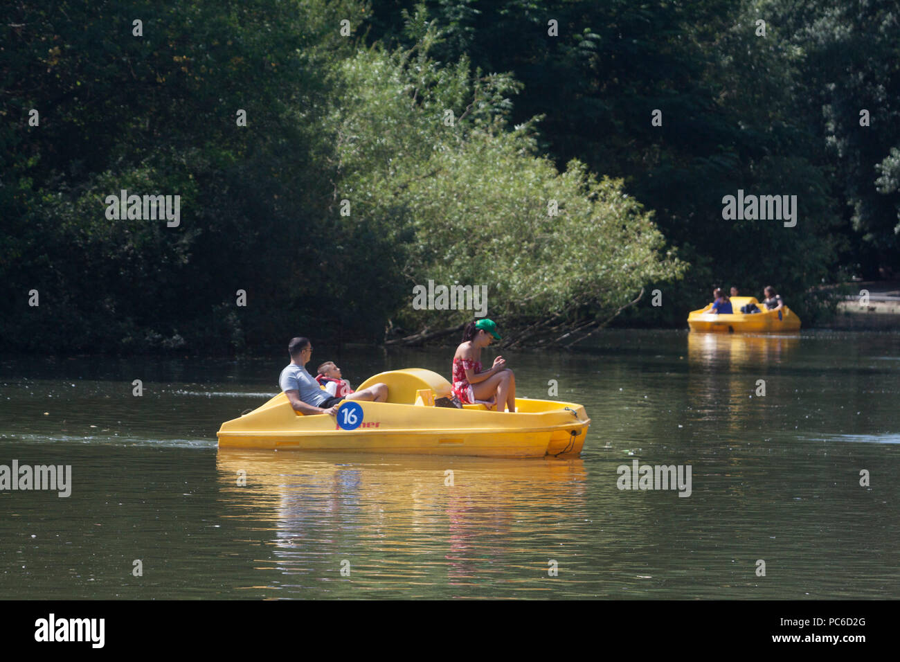 London UK. 1st August 2018. People enjoy paddle boating in Battersea Park on a hot day as the  warm temperatures return  after a cool spell  and a heatwave is forecast by a  Spanish Plume and  warm air moving from the Iberian peninsula into northwest Europe and Britain Credit: amer ghazzal/Alamy Live News Stock Photo