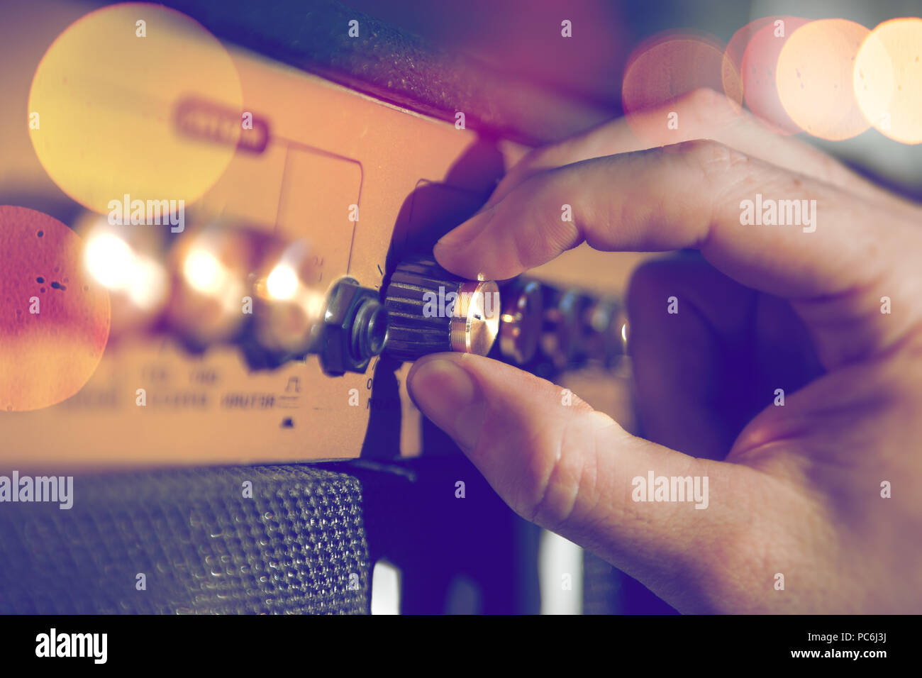 hand guitarist and guitar amp.Sound engineering and music production. musical instrument and live music Stock Photo