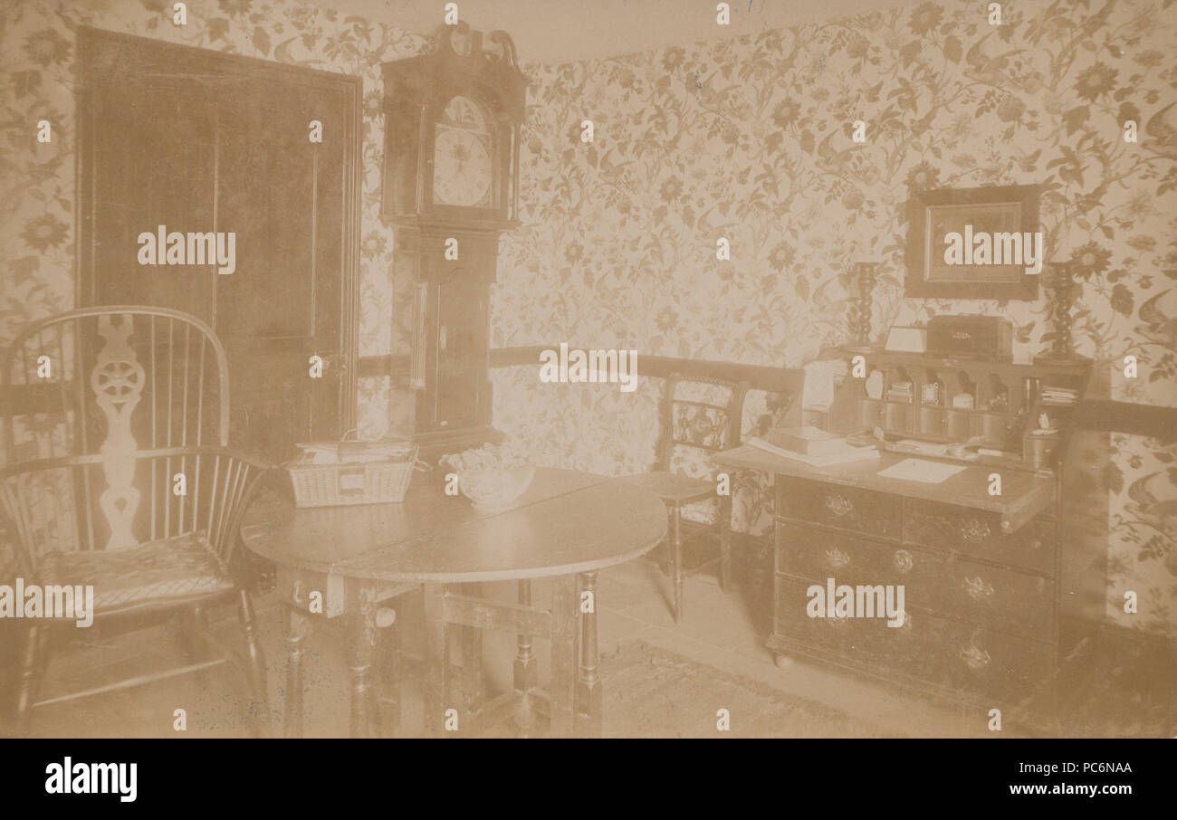 Vintage Photograph Showing The Wallpaper and Furniture of a Room Inside a Grand House. Stock Photo