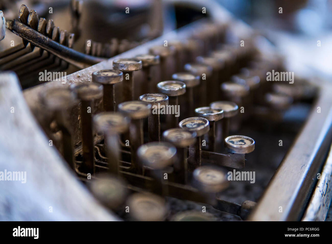 Close up view on an old dirty broken antique typewriter machine keys