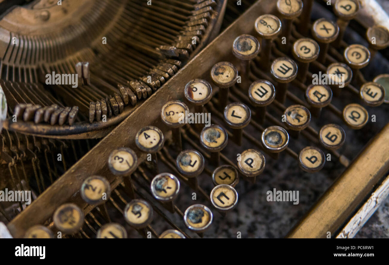Close up view on an old dirty broken antique typewriter machine keys