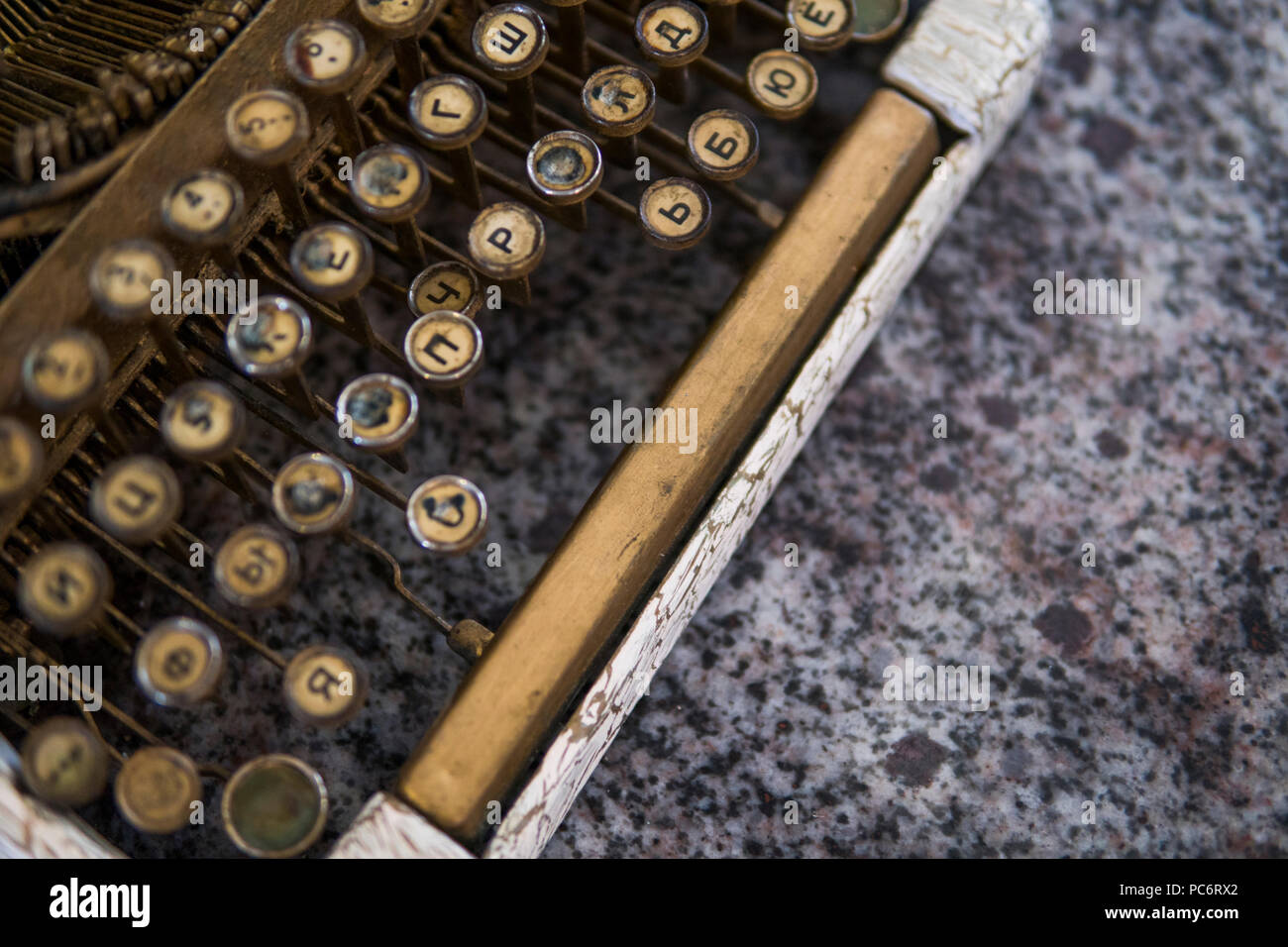 Close up view on an old dirty broken antique typewriter machine keys