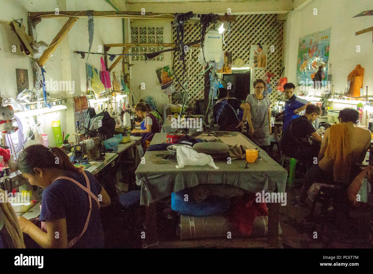 Bangkok, Thailand May 1, 2018 People sewing in a local tailor in Bangkok Stock Photo