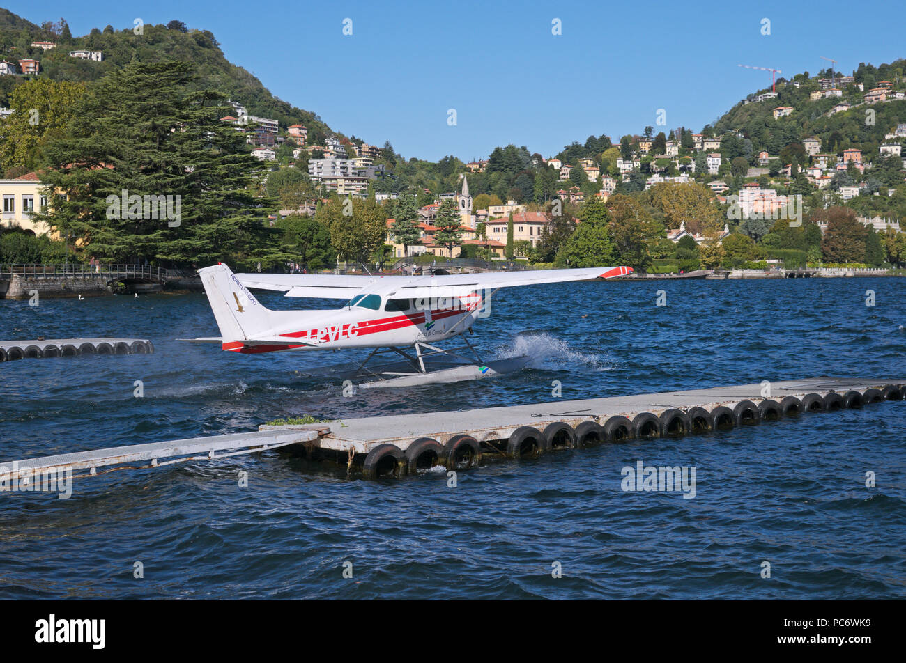 Cessna seaplane taking off in Lake of Como, Italy Stock Photo