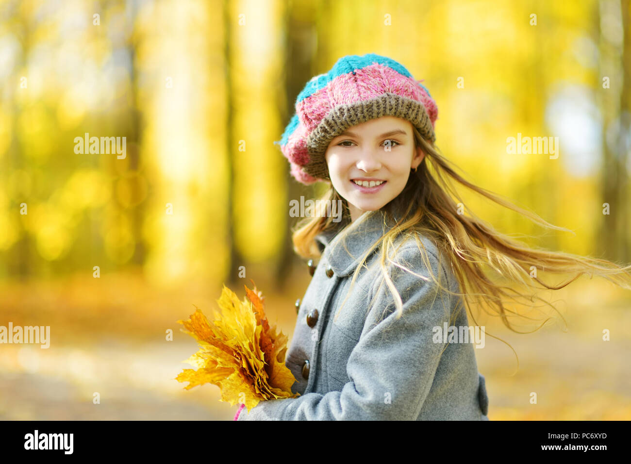Cute little girl having fun on beautiful autumn day. Happy child ...