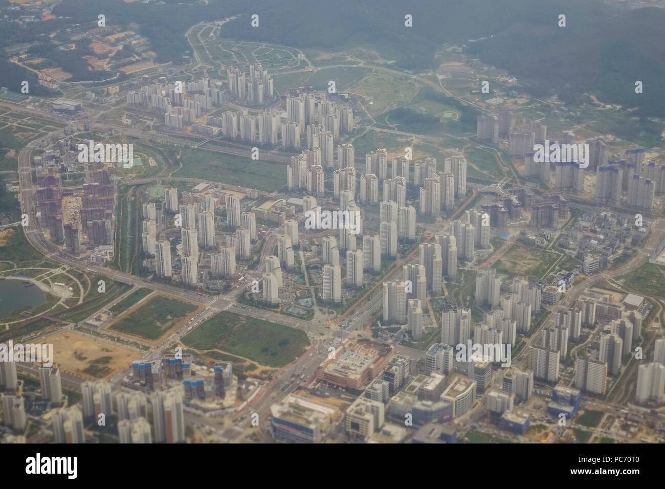 Aerial view of modern city at misty day in summer Stock Photo - Alamy