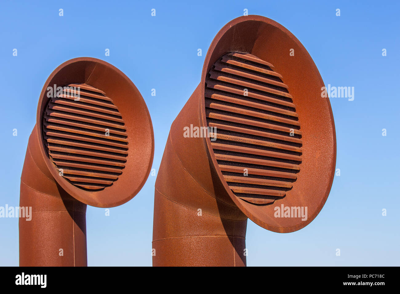 Two rusty brown metal pipes for air outlet Stock Photo