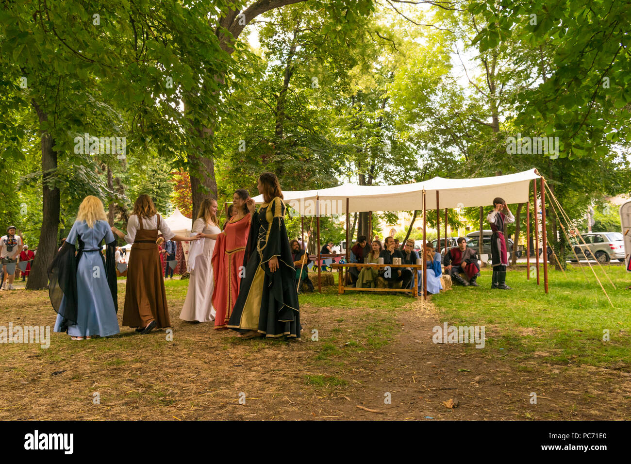 Ploiesti, Romania - July 14, 2018: Dressed up ladies reproduce old medieval dance in outdoor scene at The Medieval Festival held in Ploiesti, Prahova, Stock Photo