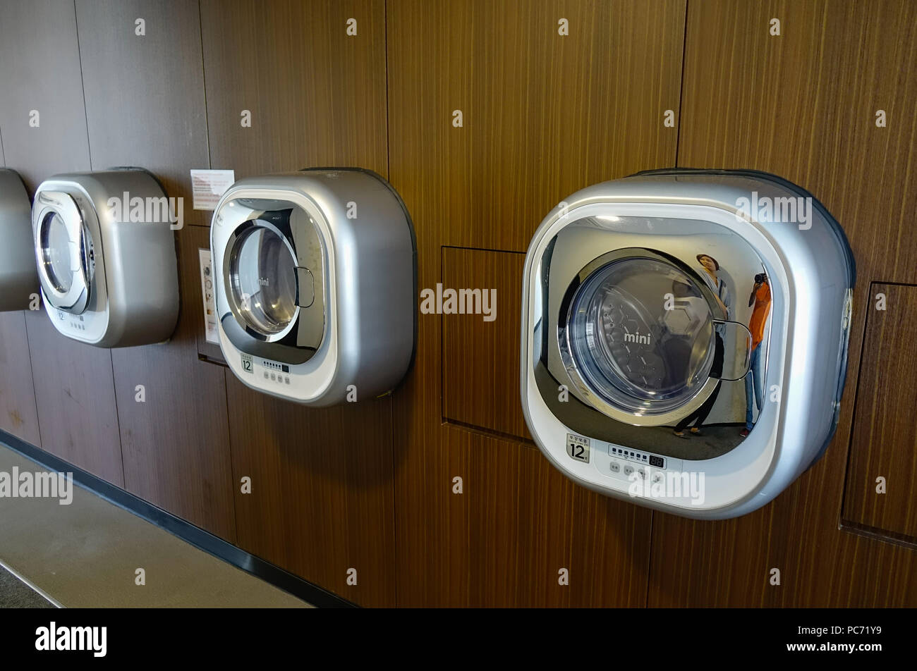 Seoul, South Korea - Sep 21, 2016. Automatic washing machines at laundry service of Western-style cheap hotel in Seoul, South Korea. Stock Photo