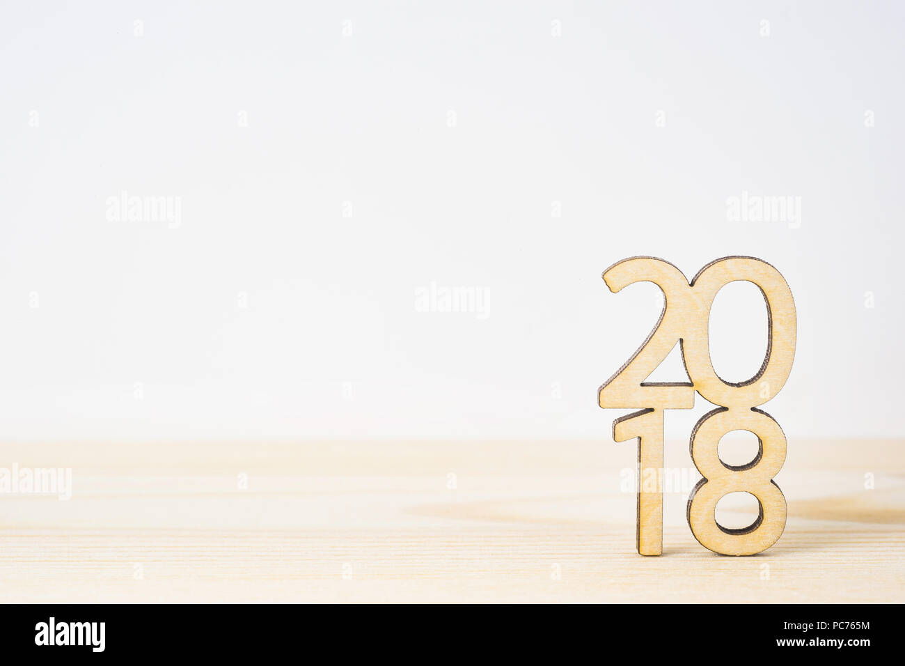 Business and design concept - wooden word " 2018 " on table and white background Stock Photo