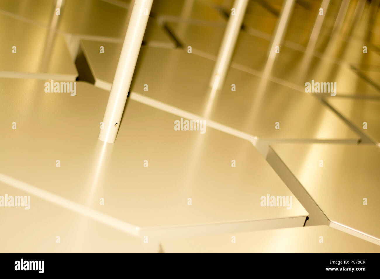 Abstract industrial zigzag pattern sharpness gradient with beams of light and warm colors backdrop Stock Photo