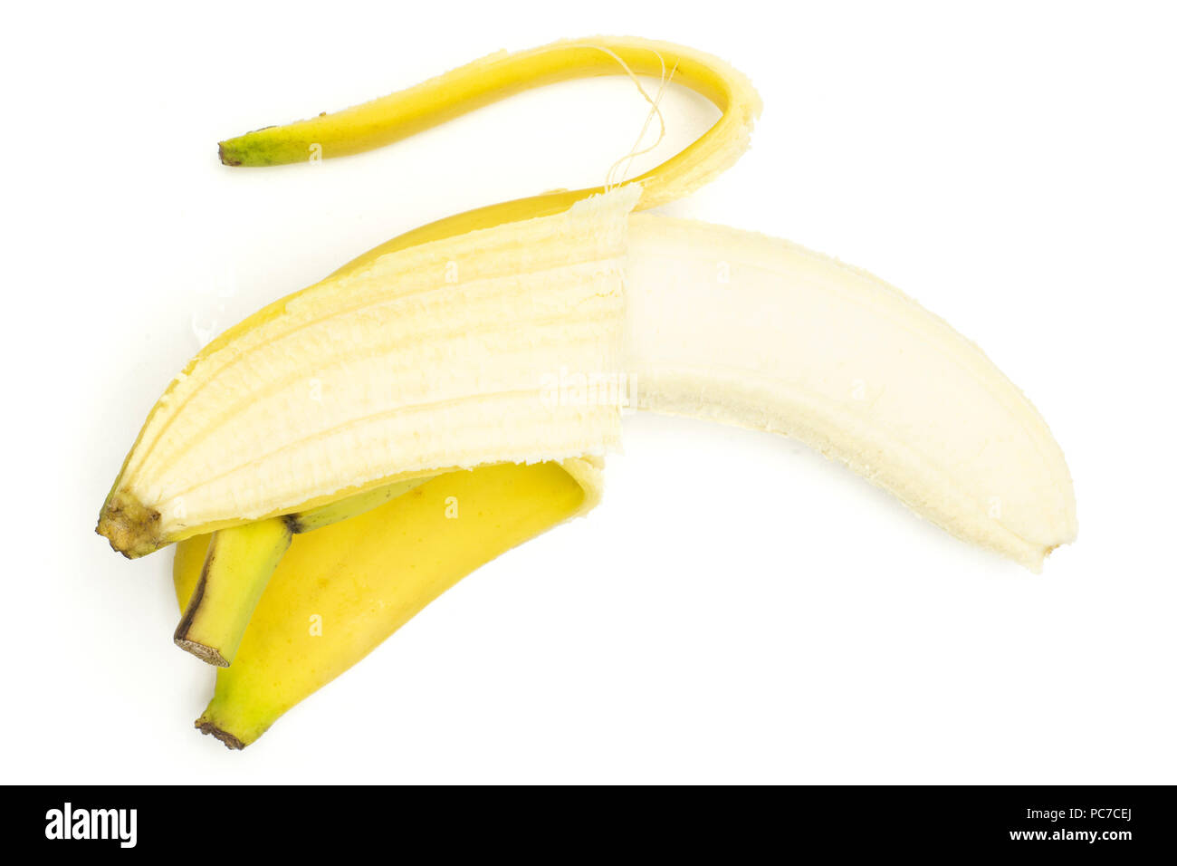 One whole opened fresh yellow banana flatlay isolated on white background Stock Photo