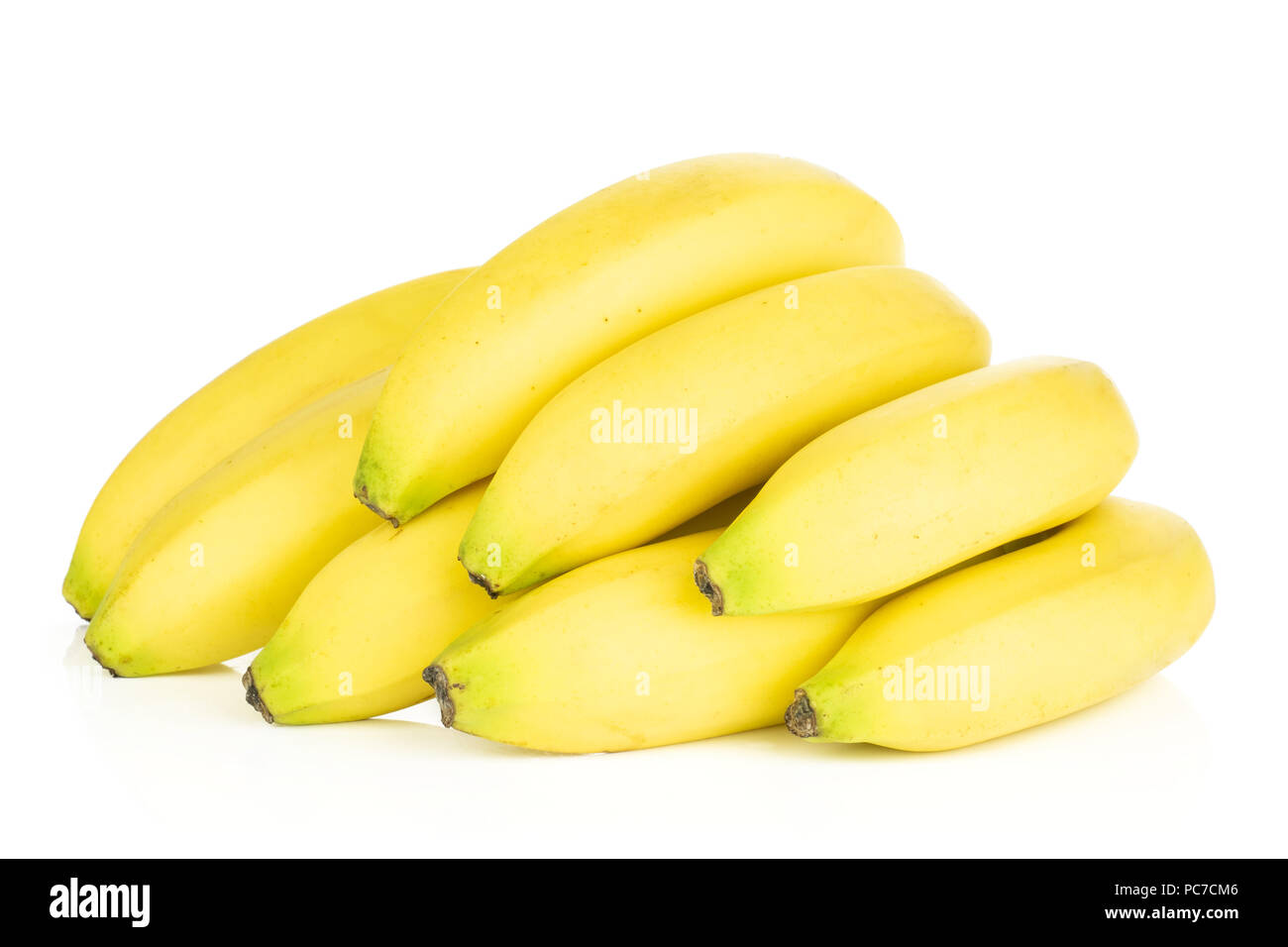 Group of eight whole fresh yellow banana isolated on white background Stock Photo