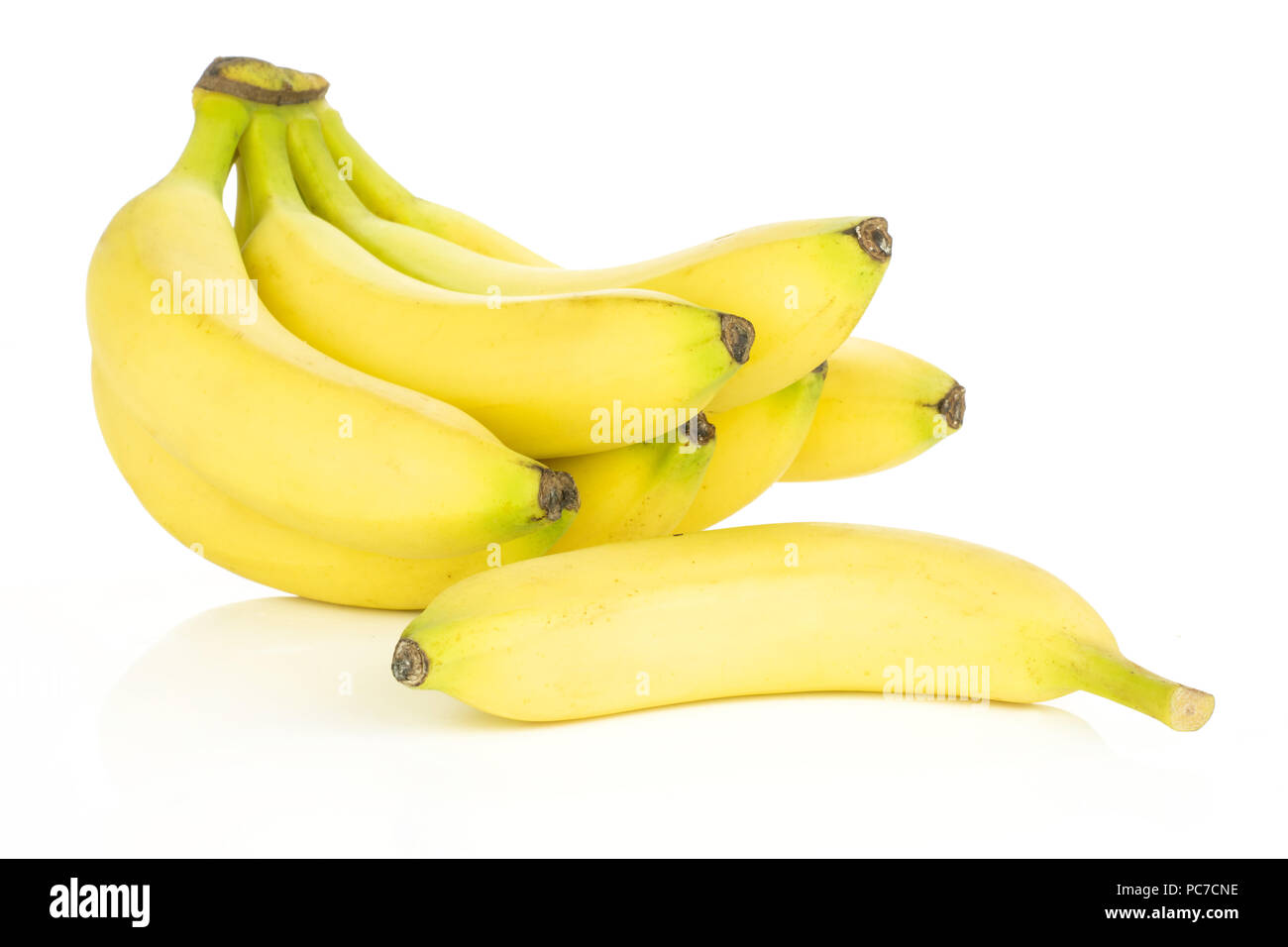 Lot of whole fresh yellow banana one cluster with separated banana isolated on white background Stock Photo
