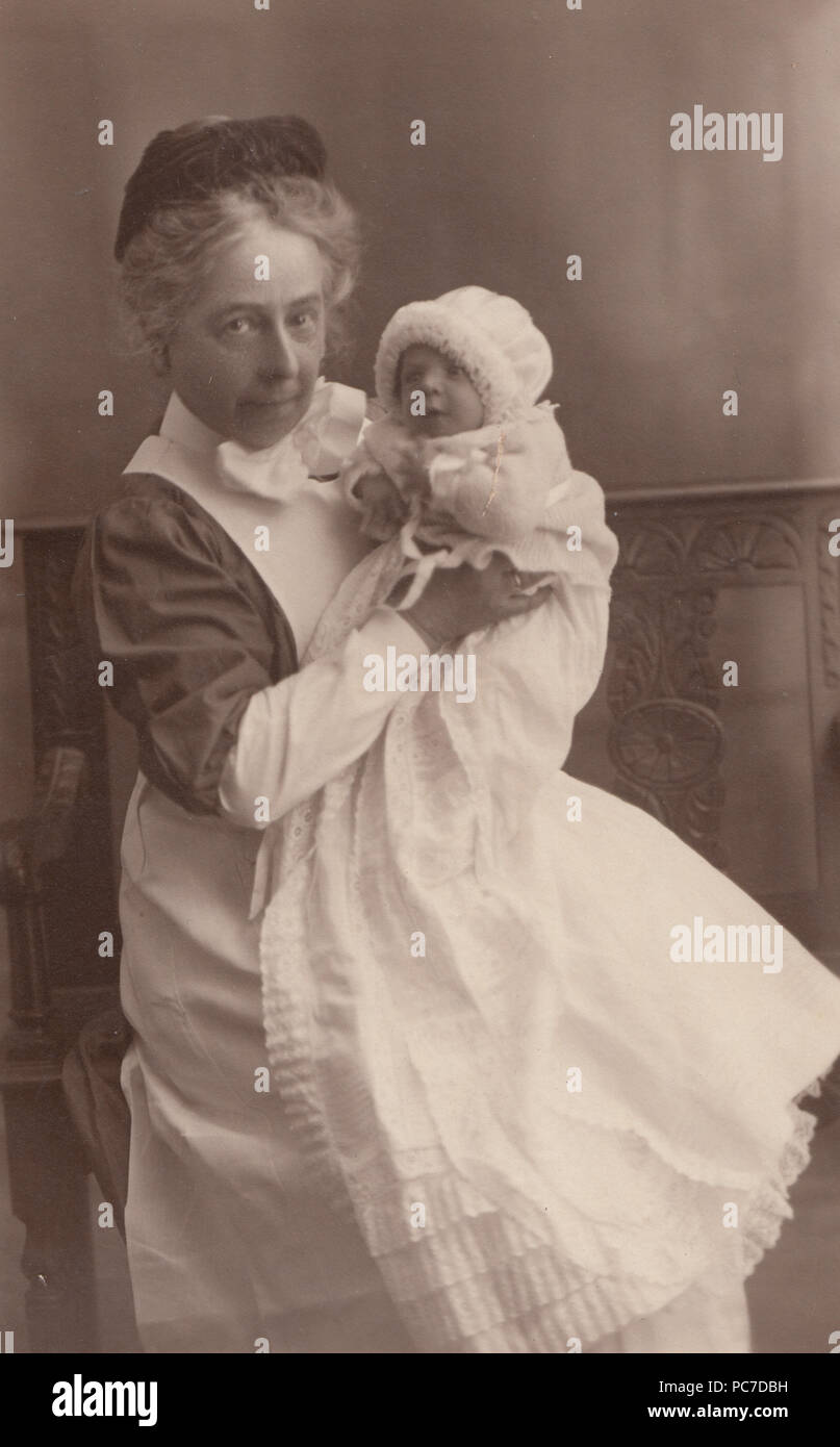 Vintage Photograph of a British Nurse With a New Born Baby Stock Photo