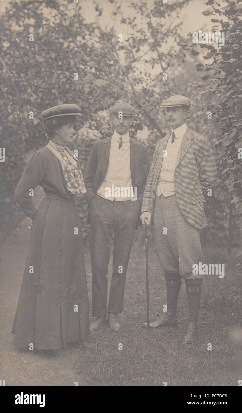 Vintage 1906 Photograph of Two Edwardian Men and an Edwardian Lady Wearing Fashionable Clothing Stock Photo
