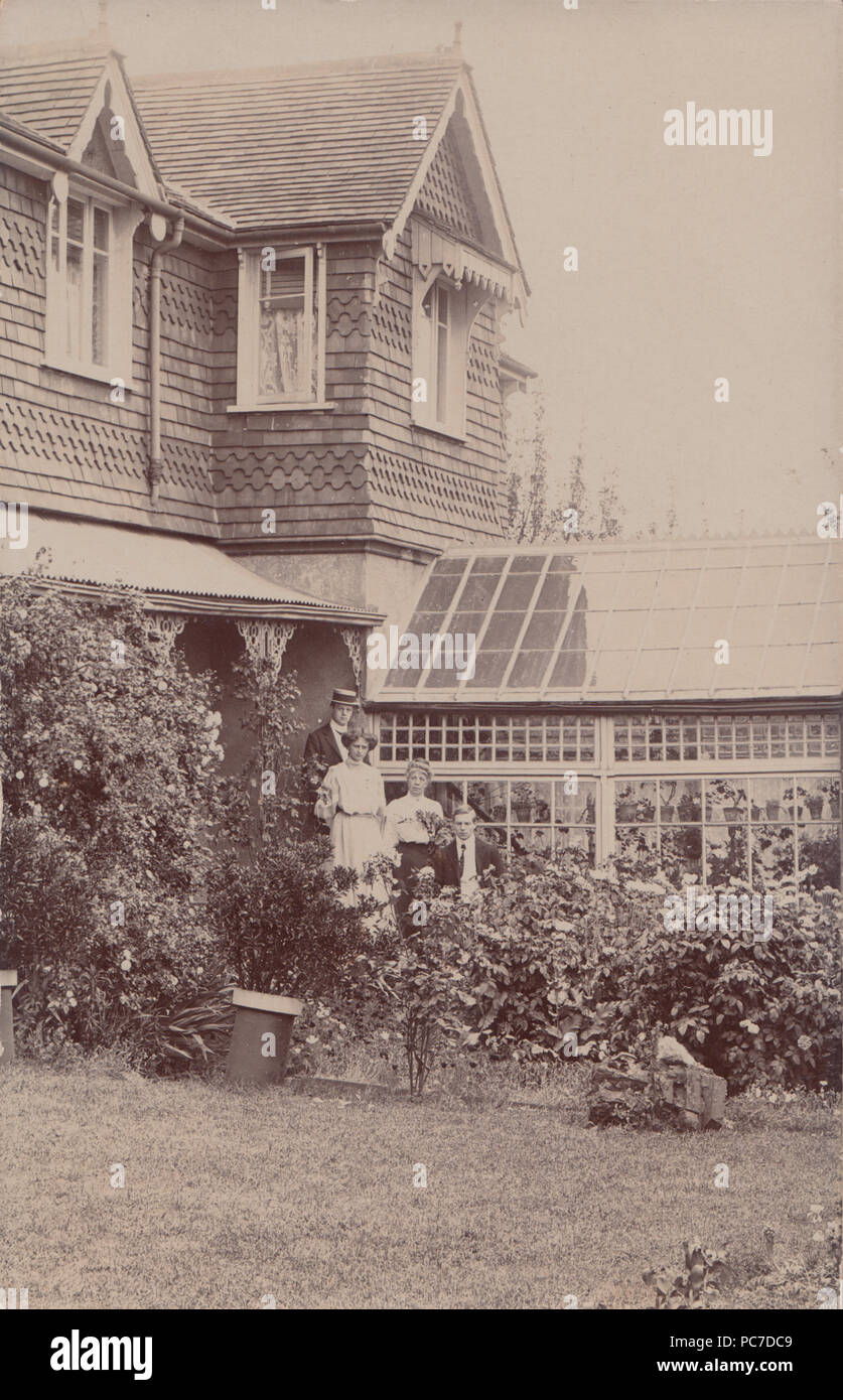 Vintage Photograph of British House With a Conservatory / Greenhouse Stock Photo