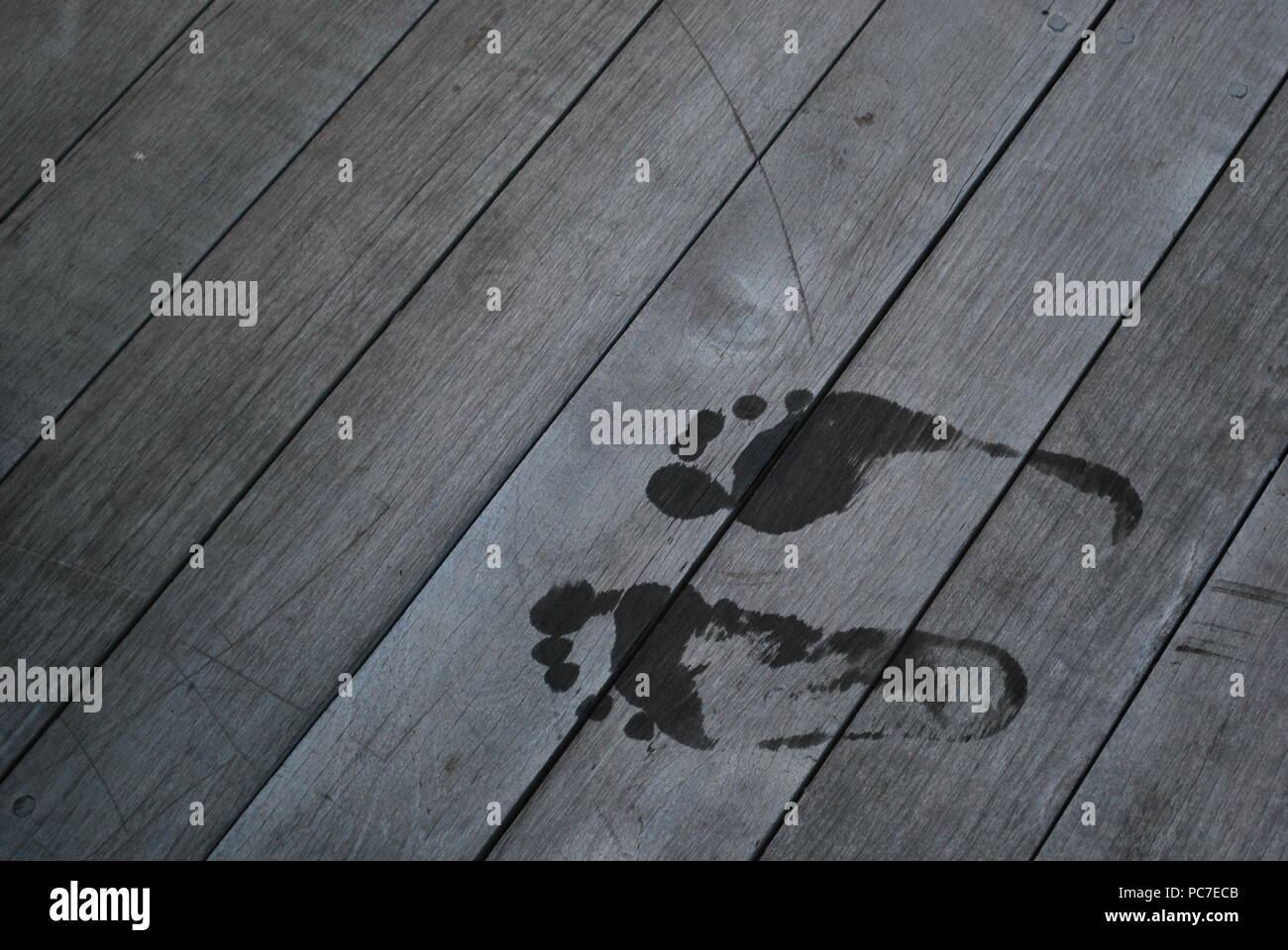 Wet footprints on a deck hires stock photography and images Alamy