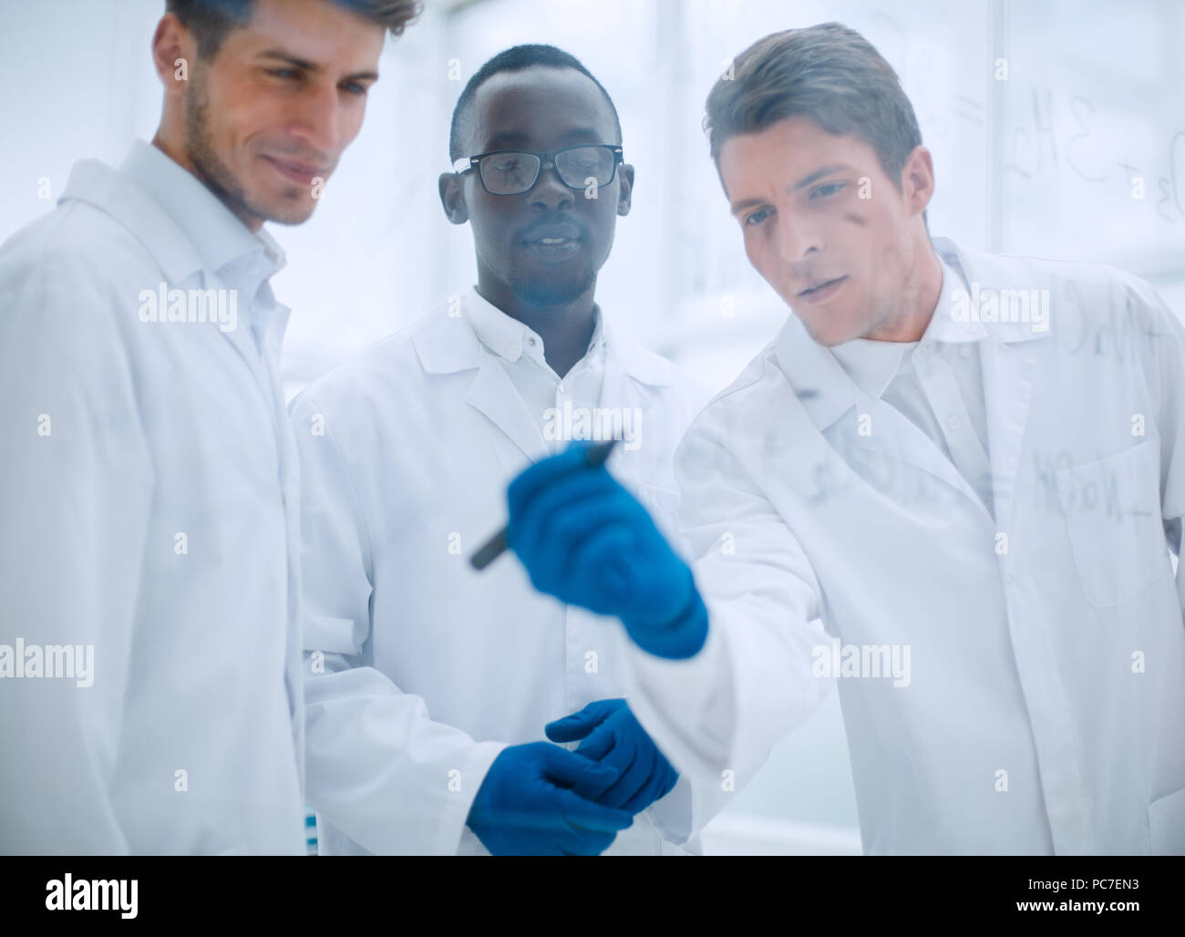promising scientist makes notes on the Board Stock Photo
