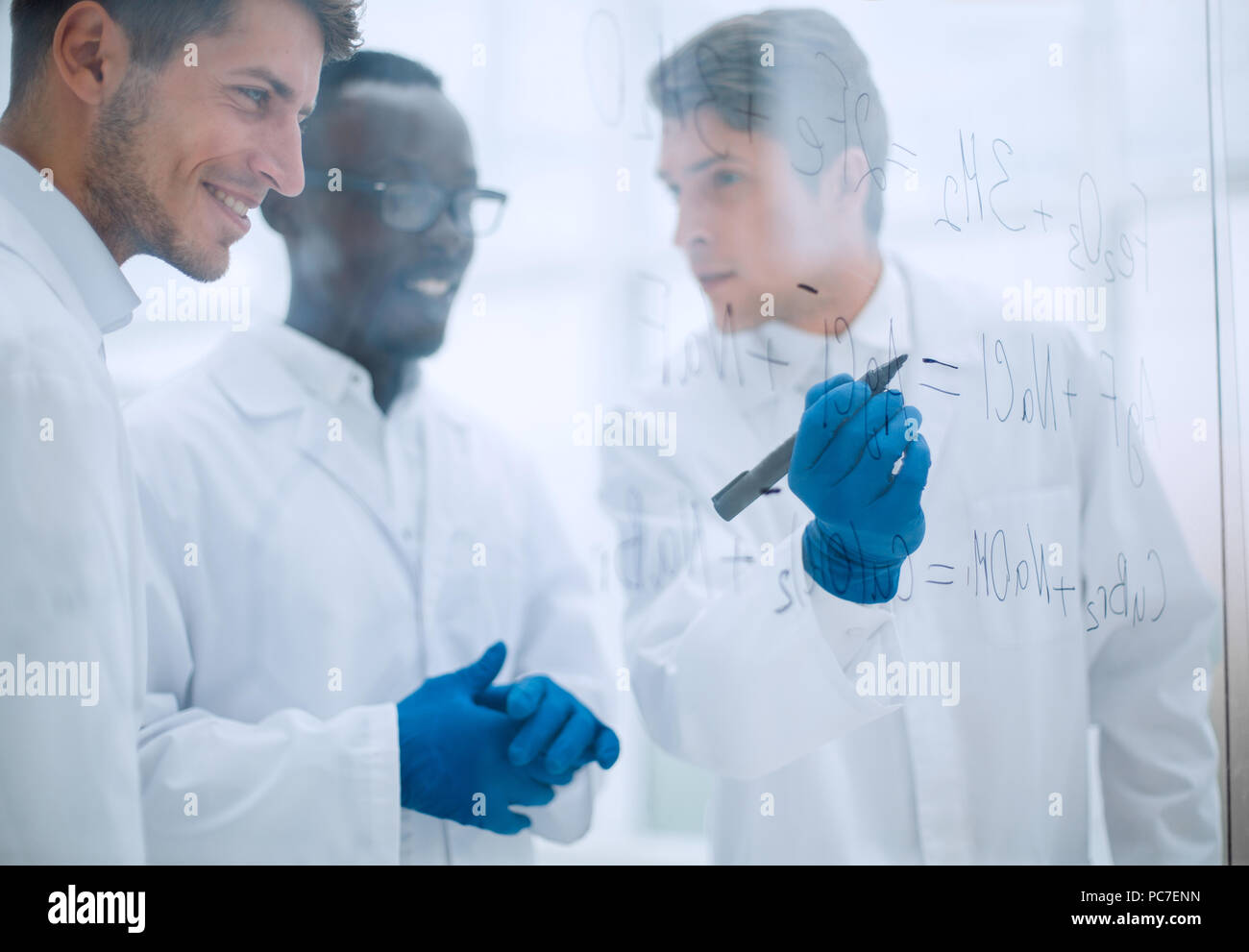 promising scientist makes notes on the Board Stock Photo