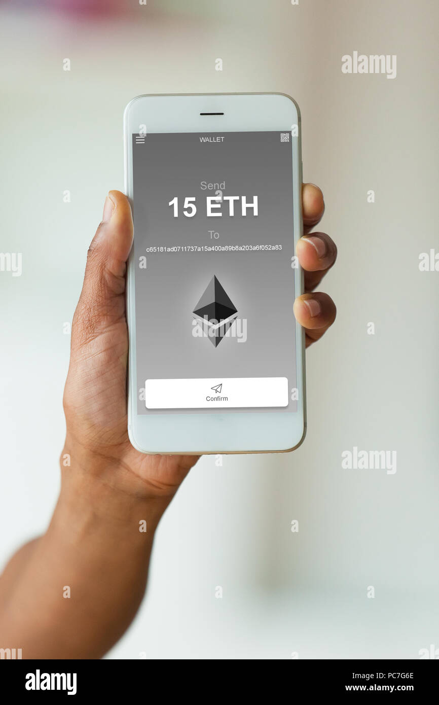 African american person sending a ethereum eth crypto transaction using  mobile phone wallet - Black people Stock Photo - Alamy