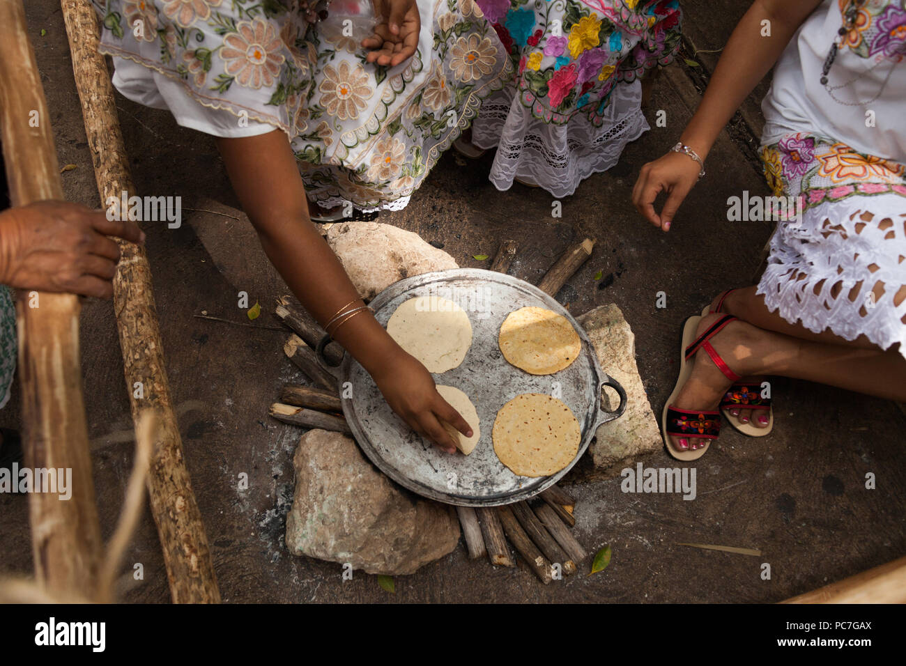 Mestizas preparing food and making tortillas at the altar contest of Hanal Pixan (day of the dead) in downtown Merida, Yucatan, Mexico. Stock Photo