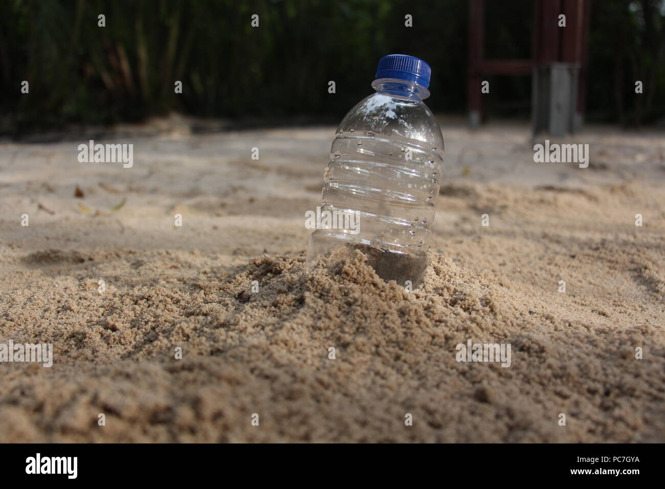 plastic bottle on sand Stock Photo Alamy