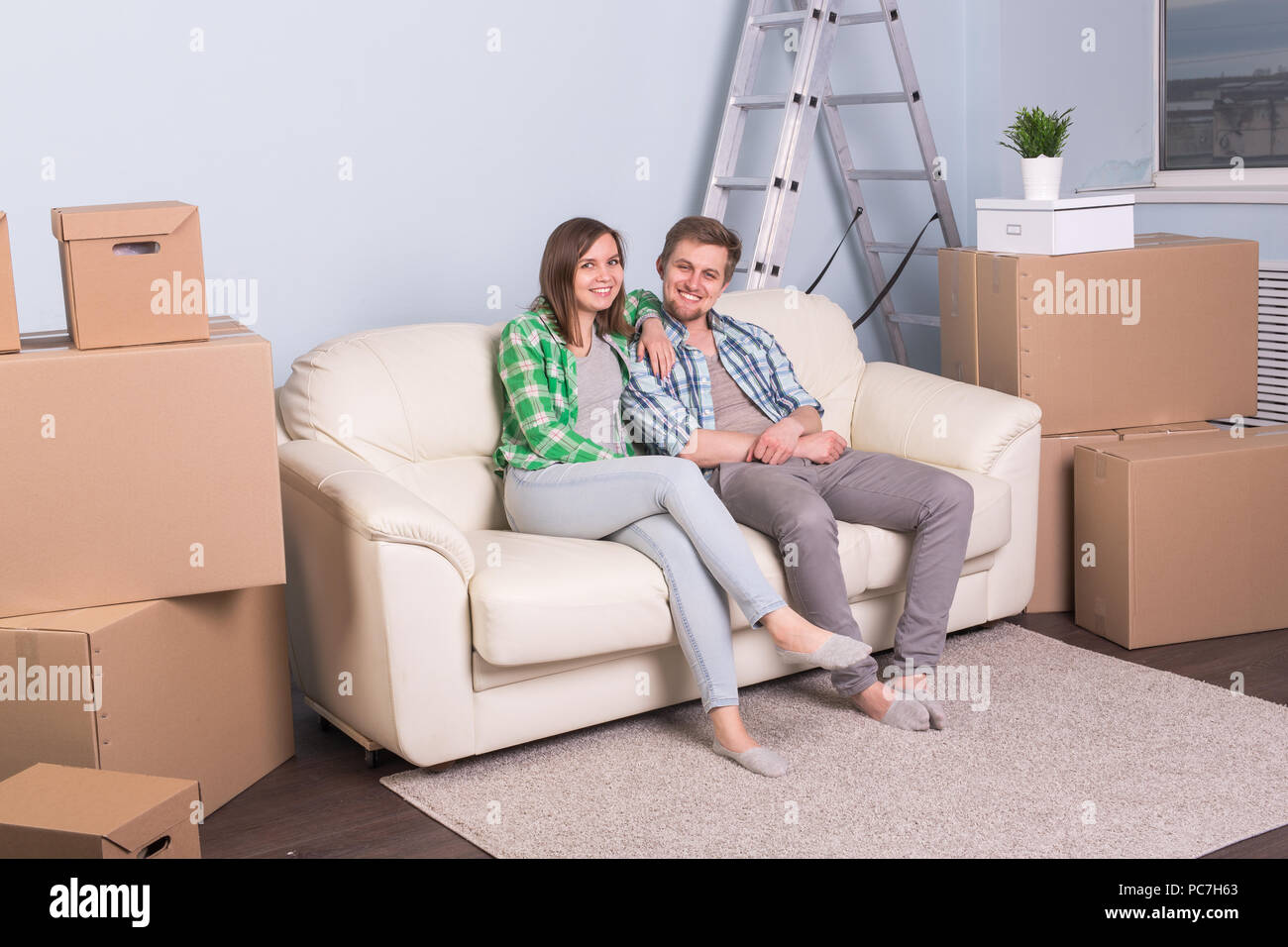 Home People And Moving Concept Attractive Young Couple Sit Sit