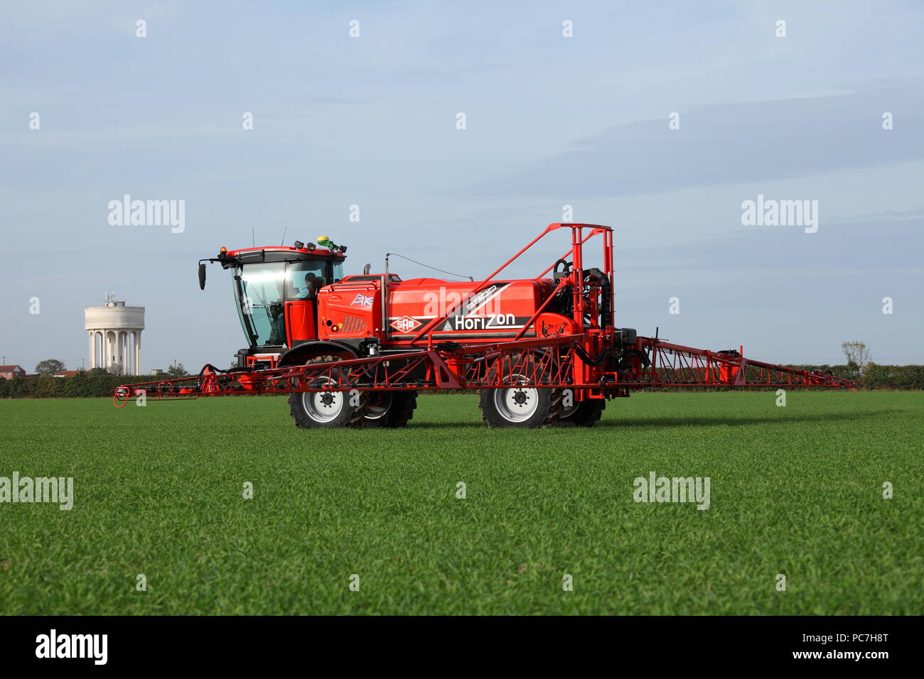 A SAM - Sands Agricultural Machinery -  self propelled crop sprayer. Seen here applying fertiliser / fertilizer to a young crop in the UK. Stock Photo