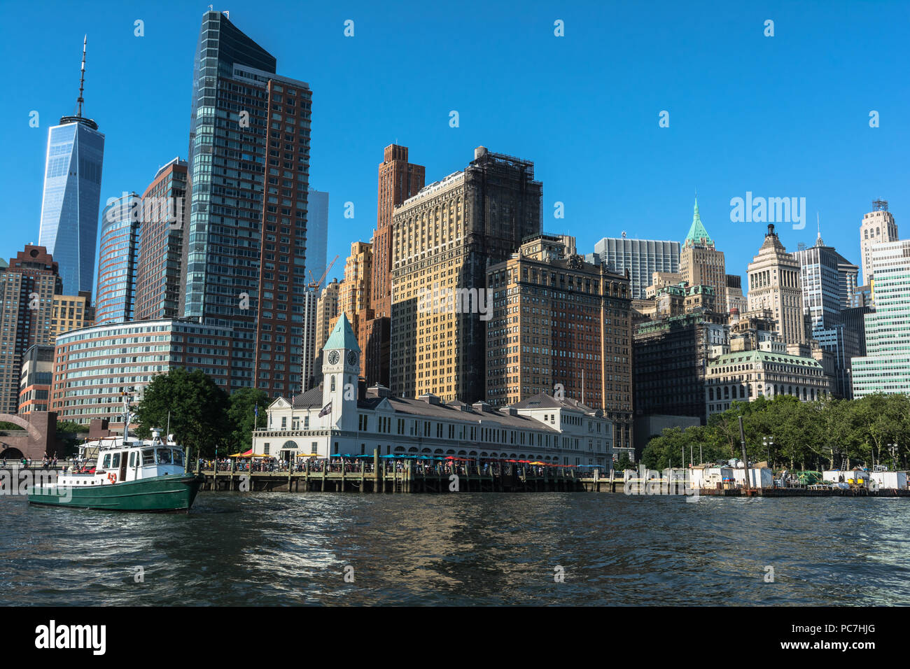 Manhattan,New York City,USA - June 30, 2018 : Skyscrapers and Pier A at Battery Park view from the Hudson River Stock Photo