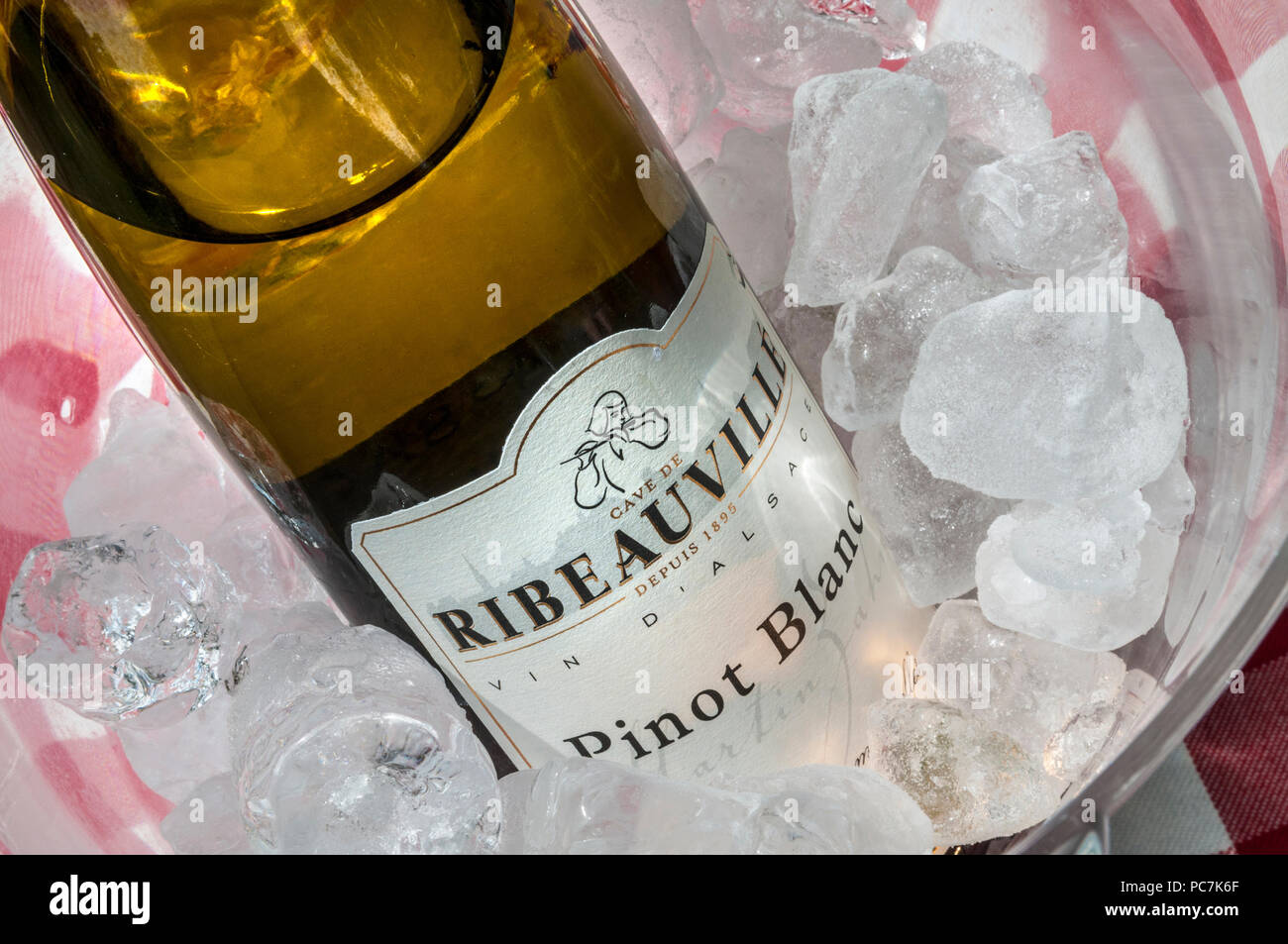 Pinot Blanc white wine bottle chilling in wine cooler Cave de