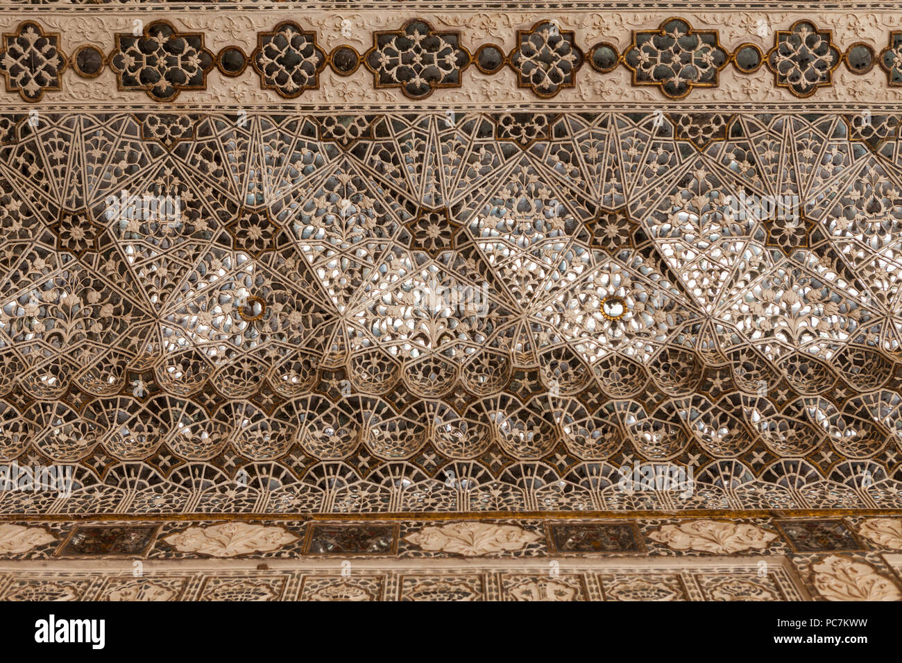 Ornate latticework ceiling inside Amber Palace / Amer Fort Stock Photo