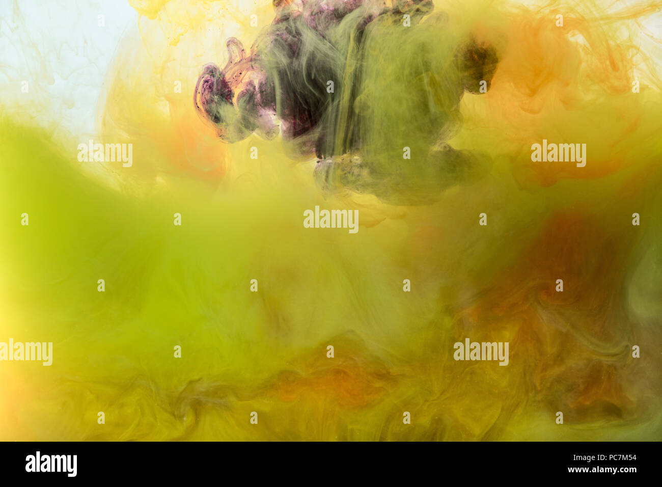 artistic background with flowing yellow, orange and purple paint Stock Photo