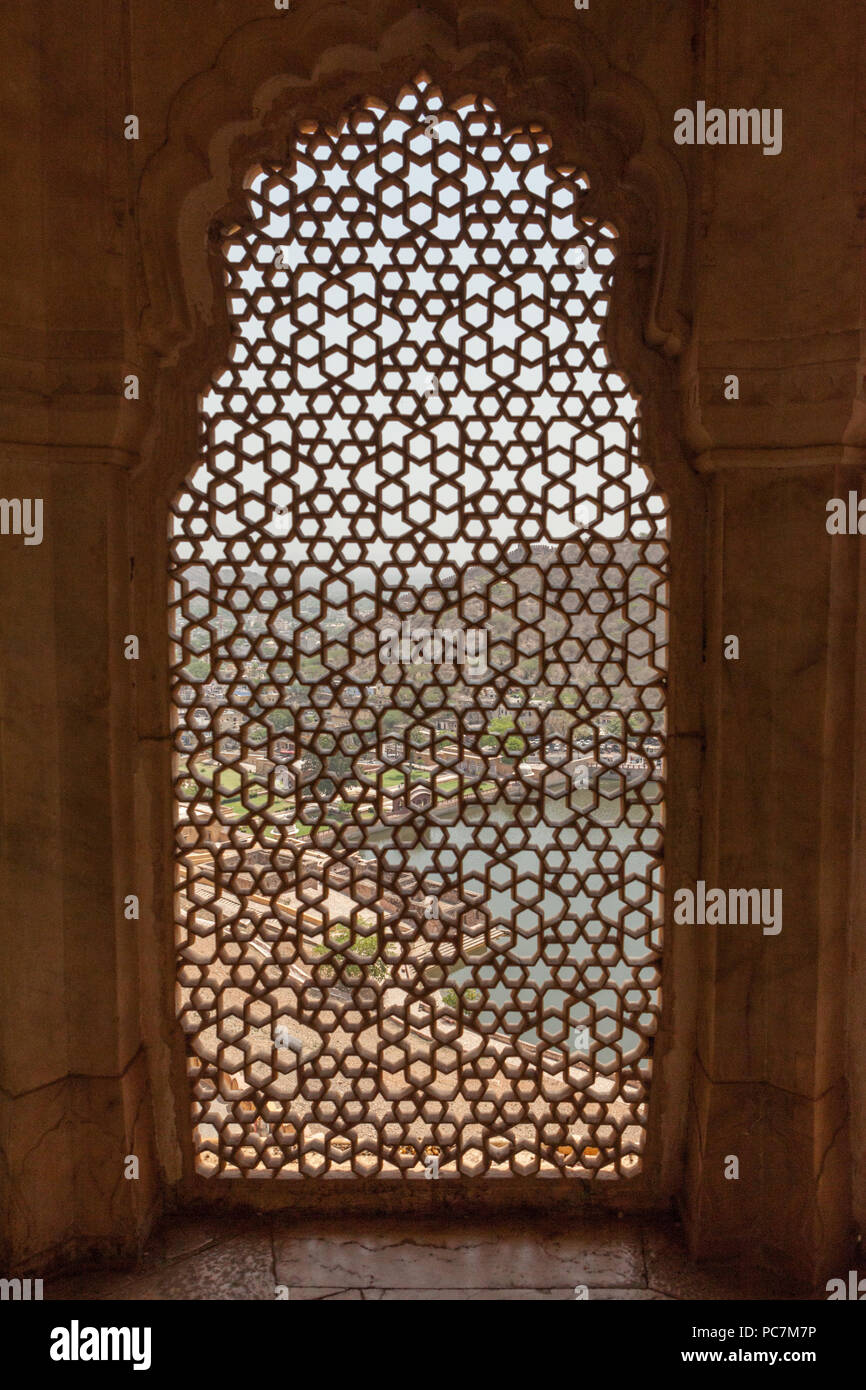 View through ornate latticework window in Amber Palace / Amer Fort Stock Photo