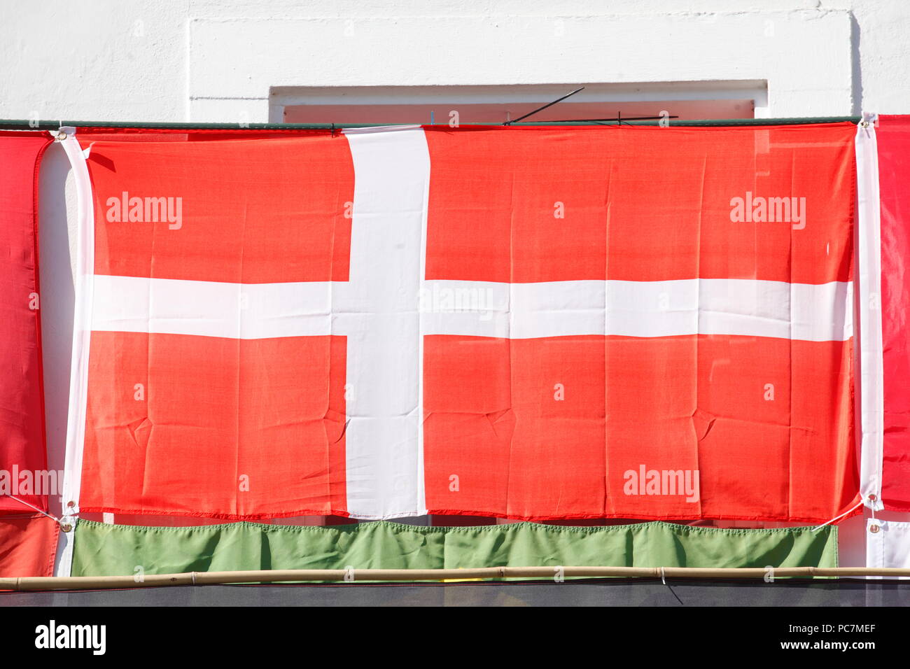 Danish national flag hung on a house wall, old town, Saarbruecken, Germany, Europe  I Dänische Nationalflagge an einer Hauswand aufgehängt, Altstadt,  Stock Photo