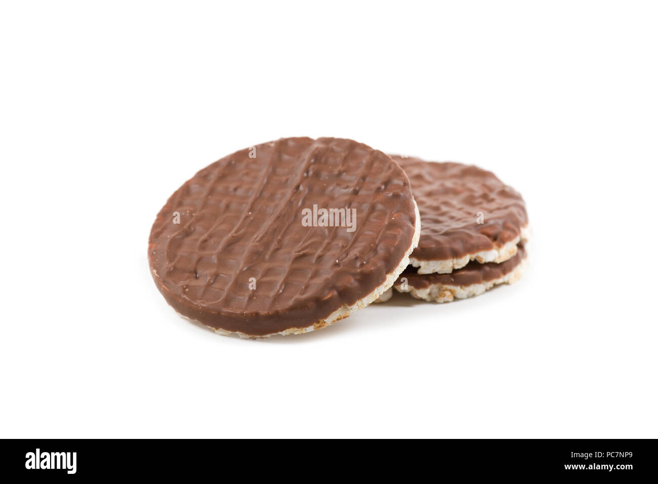 Chocolate topped rice cakes on isolated white background Stock Photo