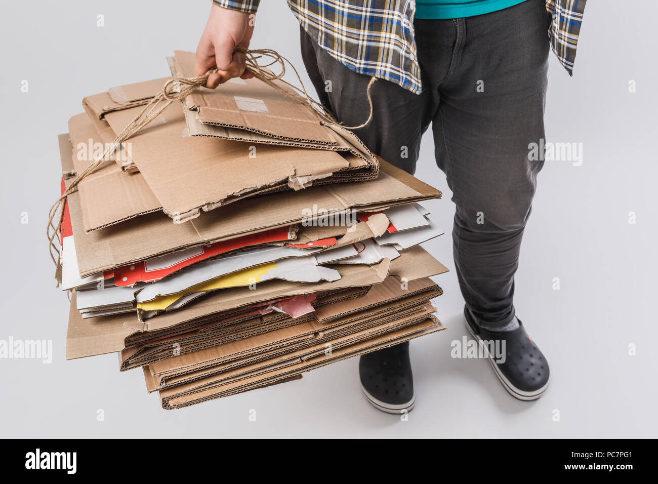 Cropped Shot Of Man Holding Pile Of Folded Cardboard Boxes Isolated On Grey Recycling Concept Stock Photo Alamy Cropped Shot Of Man Holding Pile Of Folded Cardboard Boxes Isolated On Grey Recycling Concept Stock Photo Alamy