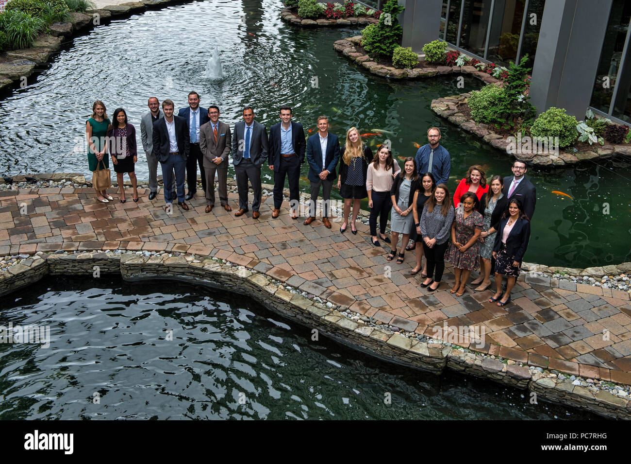 UNITED STATES: July 31, 2018: People that attended the Next Gen luncheon at the 2941 Restaurant in Arlington Virginia pose for a photo at the koi fish Stock Photo