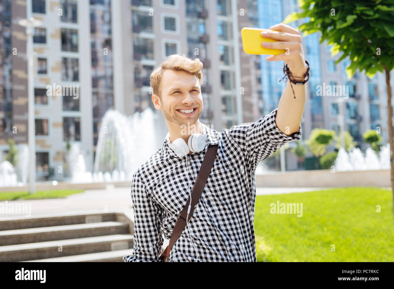 Delighted cheerful man smiling into the camera Stock Photo