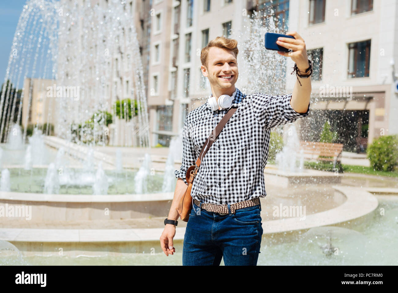 Happy handsome man taking a selfie Stock Photo
