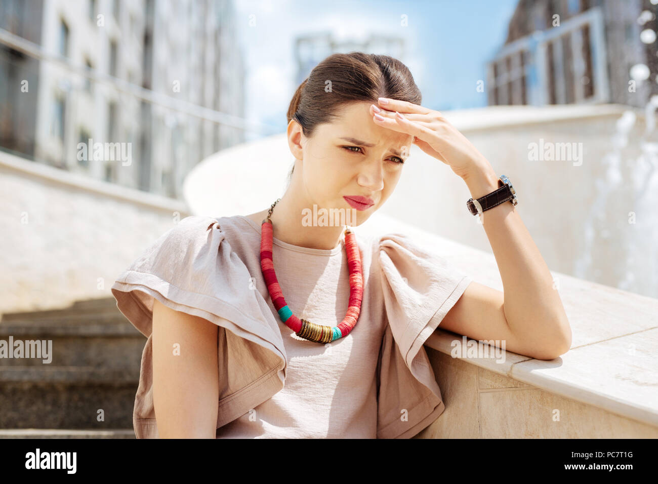 Depressed unhappy woman thinking about her problems Stock Photo