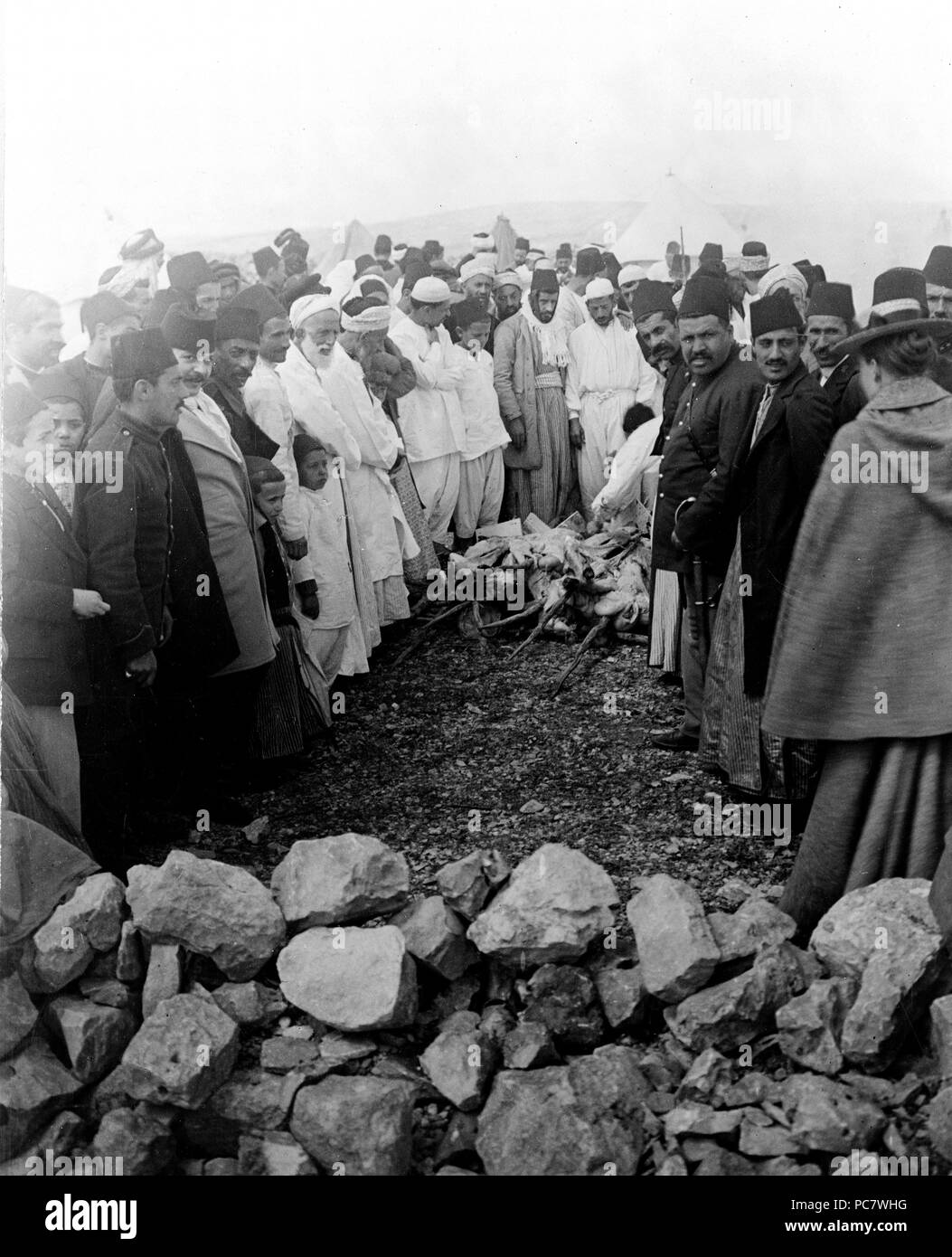 Samaritans around meat being cooked over open fire, Mount Gerizim, West Bank. Feast of the Passover 1880-1922 Stock Photo