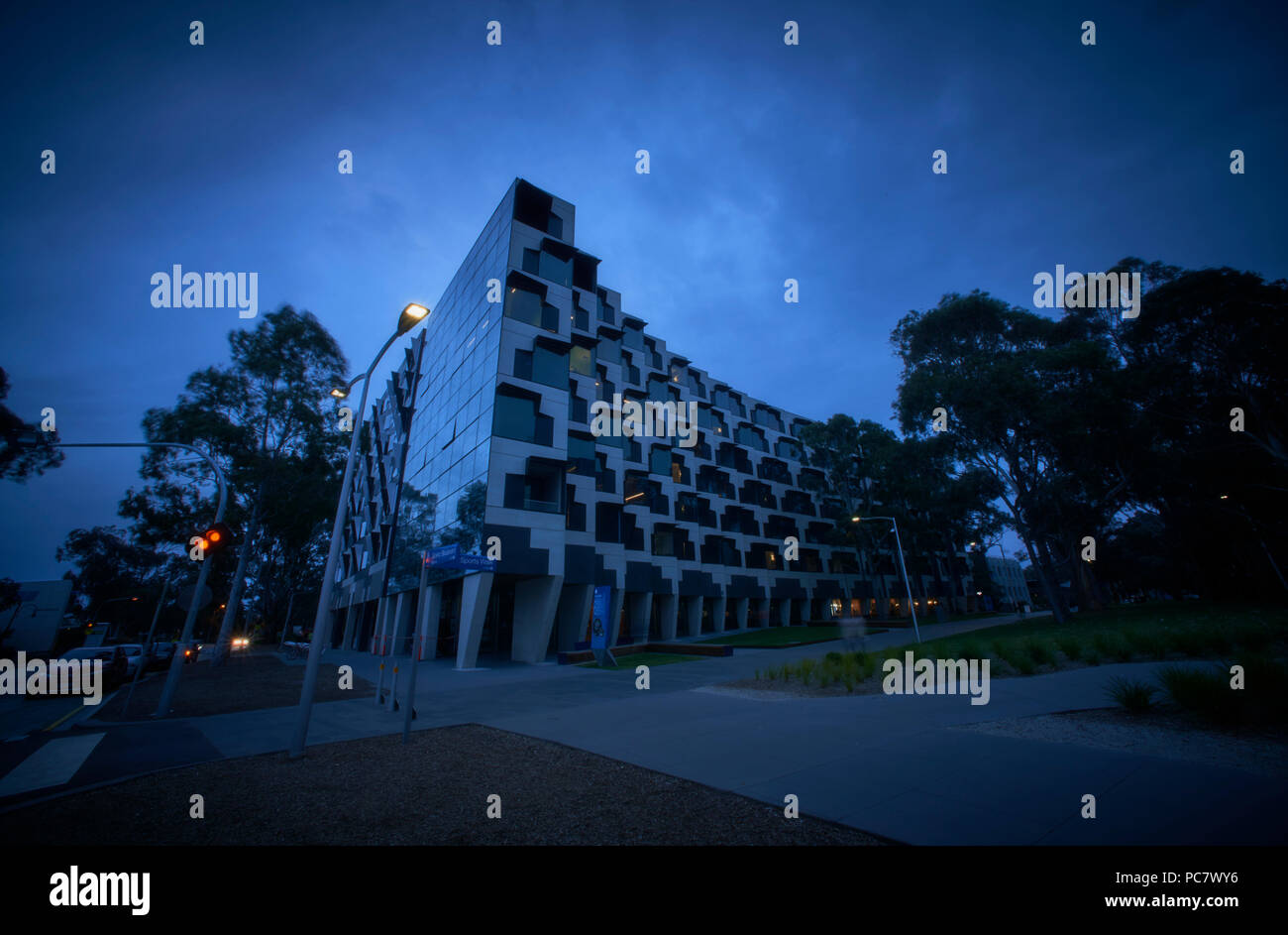 Logan Hall, halls of residence Monash University buildings at night. Stock Photo
