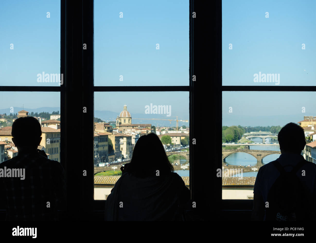 Florence (Firenze) Three Tourists Silhouetted Against View from Uffizi Gallery Stock Photo